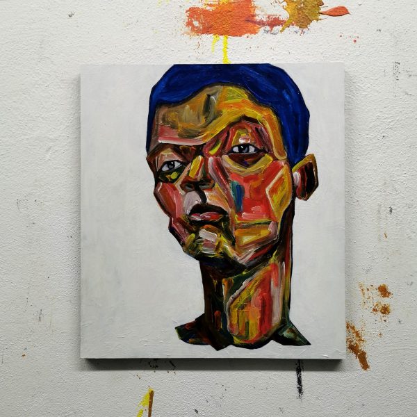 Obraz s názvem ”Výzva” je namalovaný akrylovými barvami na dřevěnou desku. Motiv obrazu je abstraktně vyobrazený mužský portrét.